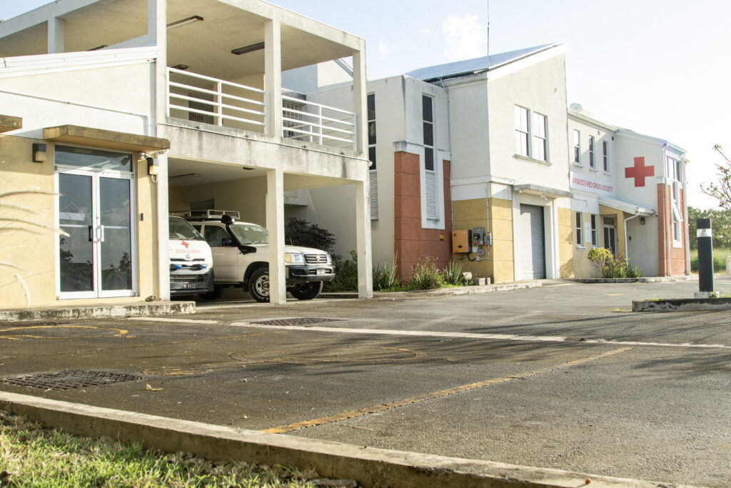 Image of the outside of the Barbados Red Cross Society building taken at midday.